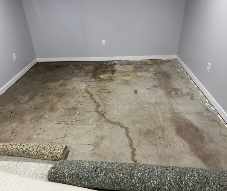 Technician restoring water‑damaged belongings in a Niles, MI home, drying household items and removing moisture to prevent staining, odors, and mold after water damage.