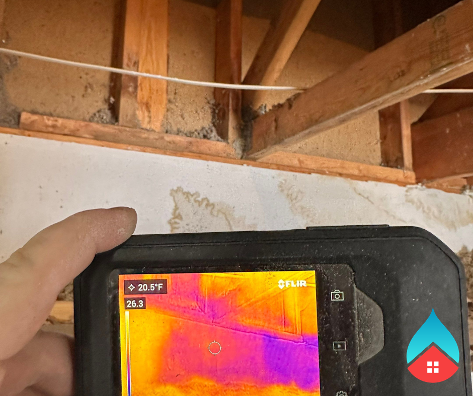 Moisture buildup and saturated foundation walls inside a crawl space after severe weather.