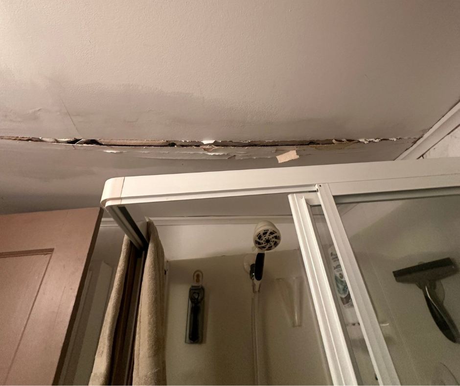 Technician performing emergency cleanup after a sudden plumbing failure in a Niles, MI home, extracting water and drying affected areas to prevent structural damage and moisture problems.