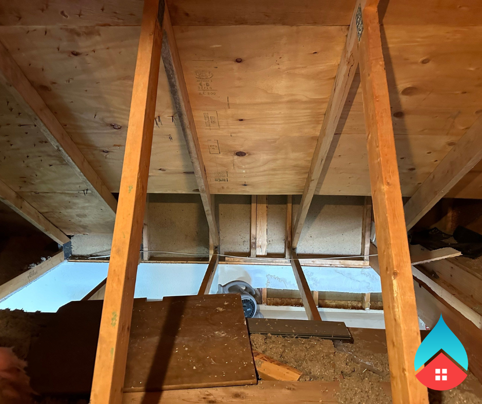 Standing water pooled in a crawlspace after heavy moisture intrusion