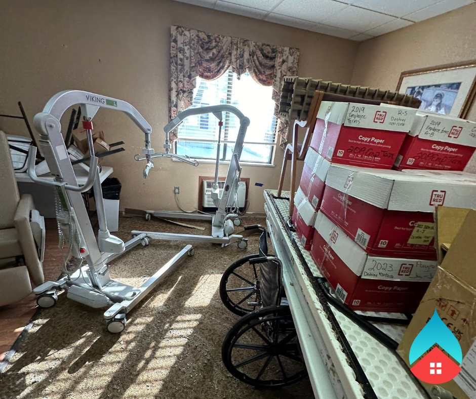 Appliance water line leak spreading across flooring during a repair in South Bend