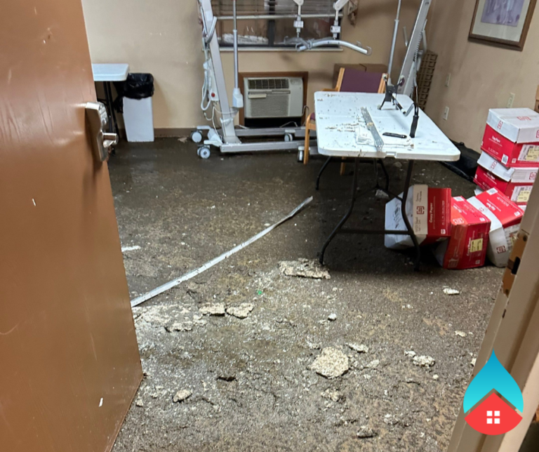 Restoration equipment drying water‑soaked carpet in a South Bend property.