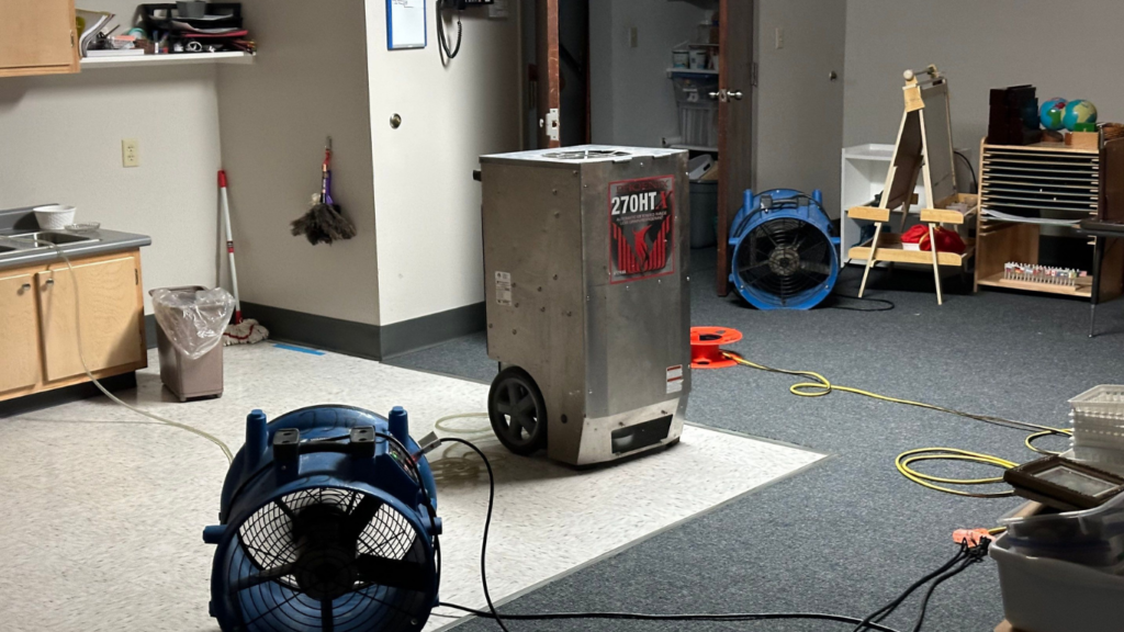 Air movers and dehumidifier set up for structural drying after water damage