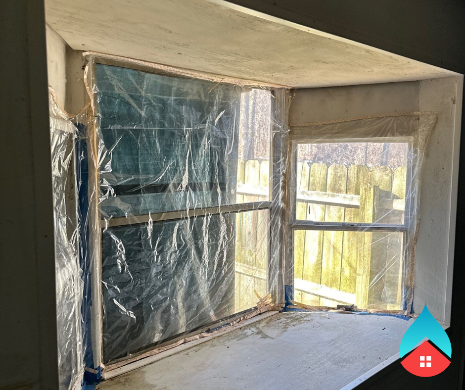 Commercial building undergoing water extraction and drying by restoration professionals