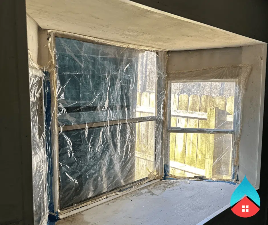 Commercial building undergoing water extraction and drying by restoration professionals